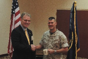 Mark Witzel (l), chapter president, thanks Maj. James Robinson, USMC, future operations officer, I Marine Expeditionary Force/G-6, following his presentation at the chapter's September luncheon.